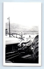 Old Vintage Photo WOMAN AND BABY DRIVING FARM TRACTOR FUNNY HUMOROUS SNAPSHOT picture