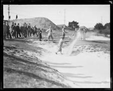 Ivo Whitton hitting a ball out of a sand bunker at a golf final, N- Old Photo picture