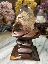 Garden Quartz white phantom free form  on custom sandalwood stand picture