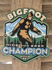 VINTAGE 1967 BIGFOOT HIDE N SEEK WILDLIFE  PORCELAIN SIGN   picture
