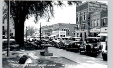 BUSY STREET SCENE waupaca wi c1950 postcard wisconsin real photo rppc downtown picture