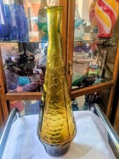 Vintage Empoli glass genie bottle with embossed fruit and leaf design. picture