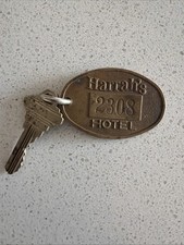 1960’s Harrah’s Hotel Brass Key Fob 2.25” Key #2308 picture