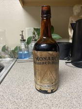 Antique Monarch Stomach Bitters Bottle Full Original Label Amber Apothecary picture