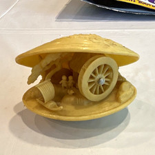 Vintage Japanese celluloid clam shell diorama.  Village scene, water wheel spins picture