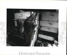 1995 Press Photo Smoker sitting on top a stack of empty bee hives. - noa74018 picture