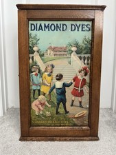 Antique Diamond Dyes Oak Store Cabinet Children Jumping Rope Litho Tin Front picture