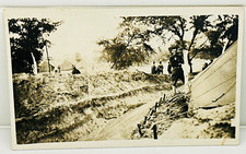 Vintage WWI RPPC Soldier at Tent Camp Dugout Embankment AZO Real Photo Postcard picture