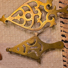 14 Antique Brass Trivets. picture