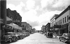 H50/ Ironwood Michigan RPPC Postcard 1953 Suffolk Ave Stores Autos 6 picture