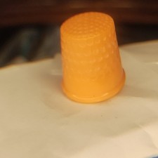 Vintage Orange plastic sewing thimble picture