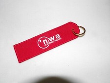 NORTHWEST AIRLINES AIRLINE KEYCHAIN EMBROIDERED BOTH SIDES AIRPLANE PILOT GIFT picture