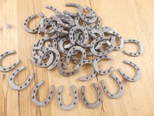 50 SMALL CAST IRON HORSESHOES  **HAVE RUST** CRAFTS BARGIN BIN DECOR HORSE SHOE picture