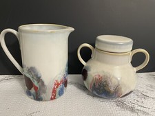 Glazed Pottery Creamer and Sugar Bowl With Lid picture