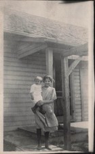 Woman Holding Baby Outside House Family Snapshot RPPC Photo Postcard 28A picture