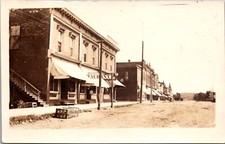 Real Photo Postcard Dirt Business Street, Restaurant in Coon Rapids, Iowa picture