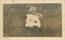Young Girl in White Dress Sitting on a Park Bench RPPC Postcard picture