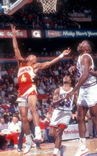 Spud Webb Atlanta Hawks goes for the lay-up as Hersey Hawkins and - Old Photo picture