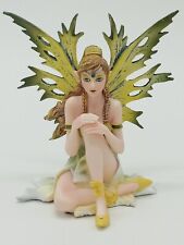 Sitting Green and Yellow Fairy with Ponytail and Braids Collectible Figurine picture