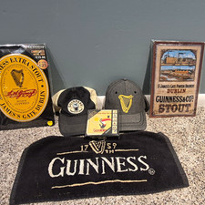 2 Guinness Signs(new,) 2 Hats (New), 6 piece coaster set(new) 1 Bar Towel (used) picture