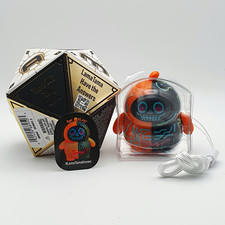 Lama Tama Lama Tama Orange/Black Plastic Figure w/ Pin & Accessory Opened Box picture