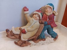 Two sided beautiful porcelain children sledding Christmas ornament picture