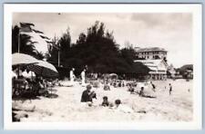 1930's RPPC WAIKIKI BEACH AMERICAN FLAG SUNBATHERS HOTELS SAILORS PHOTO POSTCARD picture