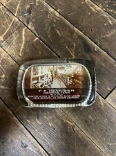 VINTAGE T. F. HENNIGER GLASS PAPERWEIGHT SIGN SPORTING GOODS BICYCLES GUNS STORE picture
