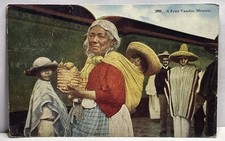 1914c Tijuana Mexico, fruit vendor, selling fruit in front of train station picture