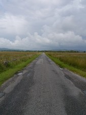 Photo A2 The B8025 Under Threatening Skies Bellanoch Rain clouds gather  c2012 picture