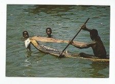 Postcard: Republic of Ivory Coast, Africa - young boys fishing; dugout boat picture