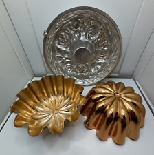 3 vintage aluminum and brass jello molds picture