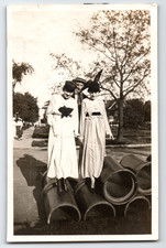 Photo Two Women and Man Balancing on Pipes Fashion Vintage 1910s picture