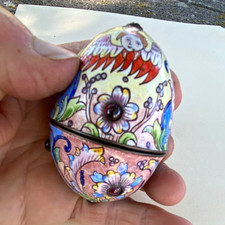 Antique egg-shaped enamel jewel box with cherubs, floral patterns and cabochons picture