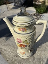 This is a vintage Porcelier electric percolator featuring a basket weave 1940s picture