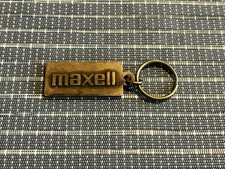 Vintage Maxell Blown Away Guy Logo Brass Keychain picture