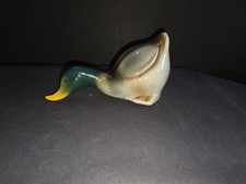vintage ceramic or porcelain mallard duck figurine depicted  