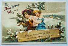 Vintage 1910s New Year Postcard BOY & GIRL CARRYING A TREE PRESENT Embossed Used picture
