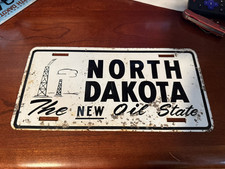 1950s North Dakota Booster License Plate Oil state picture