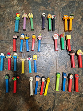 Lot of 34  PEZ Dispensers Cartoon Characters Disney Warner Bros Snoopy Garfield picture