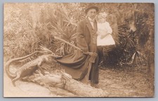 Studio RPPC Man W/ Axe Holding Girl Attacked by Alligator RPPC  Postcard E1 picture