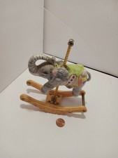 Collectible Ceramic Elephant on a Carasel picture