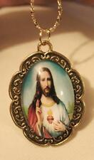 Lovely Swirl Scalloped Rim Goldtone Blue Sacred Heart of Jesus Pendant Necklace picture
