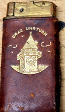 VINTAGE AUSTRIAN BRASS AND LEATH CIGARETTE LIGHTER-GRAZ IN GOLD WITH CLOCK TOWER picture