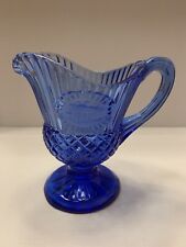 Vintage Royal Blue Small Depression Glass Pitcher With a Building On It picture