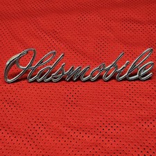 Vintage OEM Oldsmobile 1970 Script Emblem 399094 picture